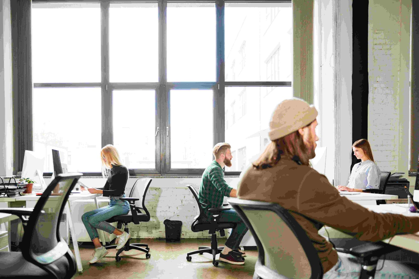 colleagues work at the office with computers